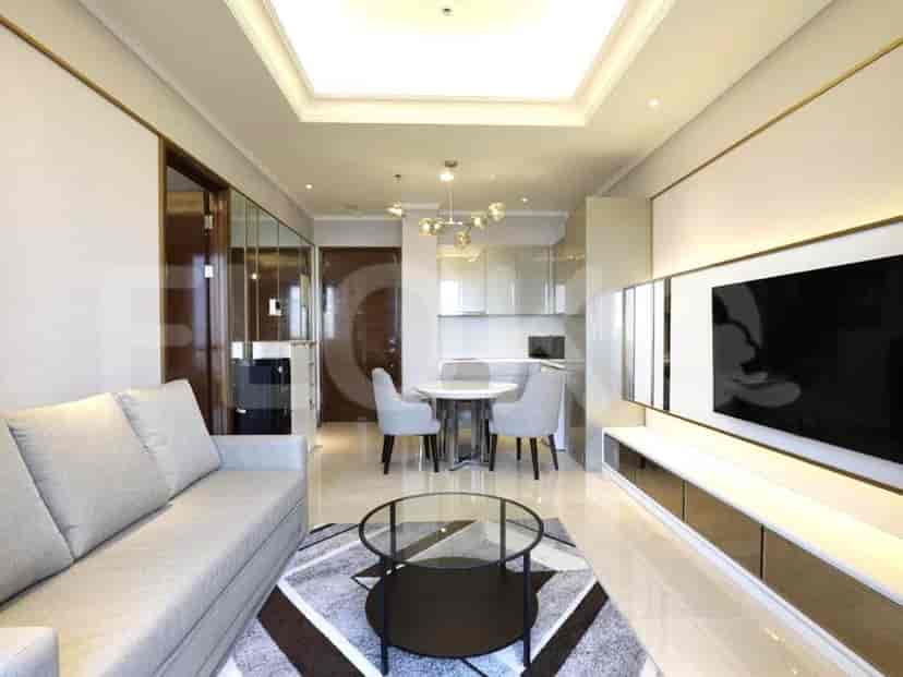 Elegant living room with a grey sofa, dining table, and modern design.