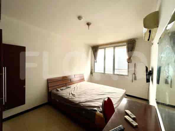 Bedroom with a bed, closet, and desk.