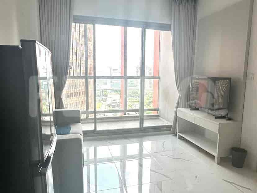 A living room with large windows and a modern interior.