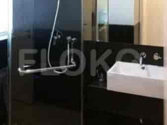 Modern bathroom with a shower, sink, and faucet.
