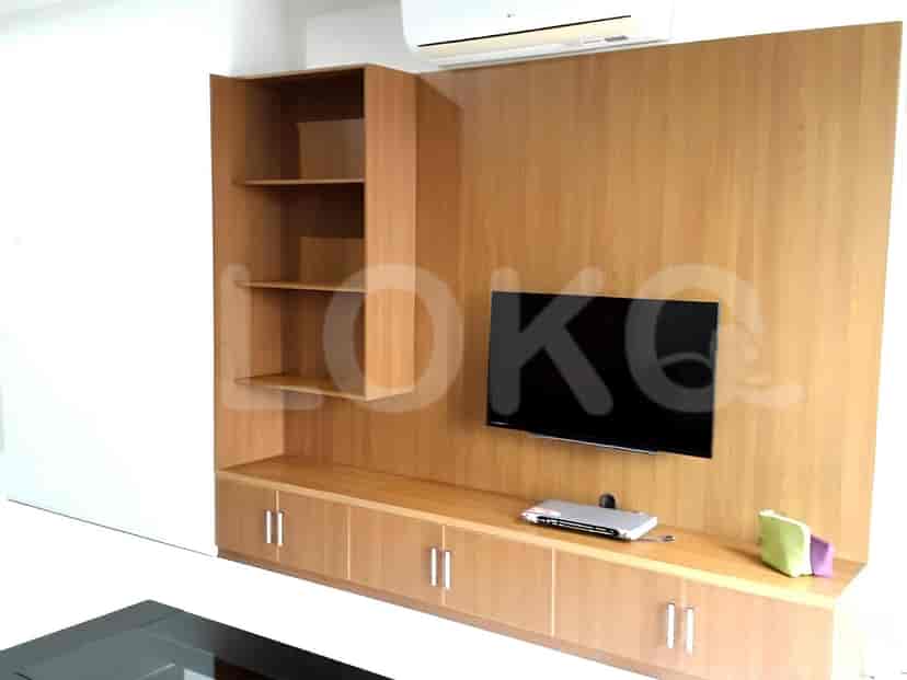 The wall-mounted smart TV and storage compartments
