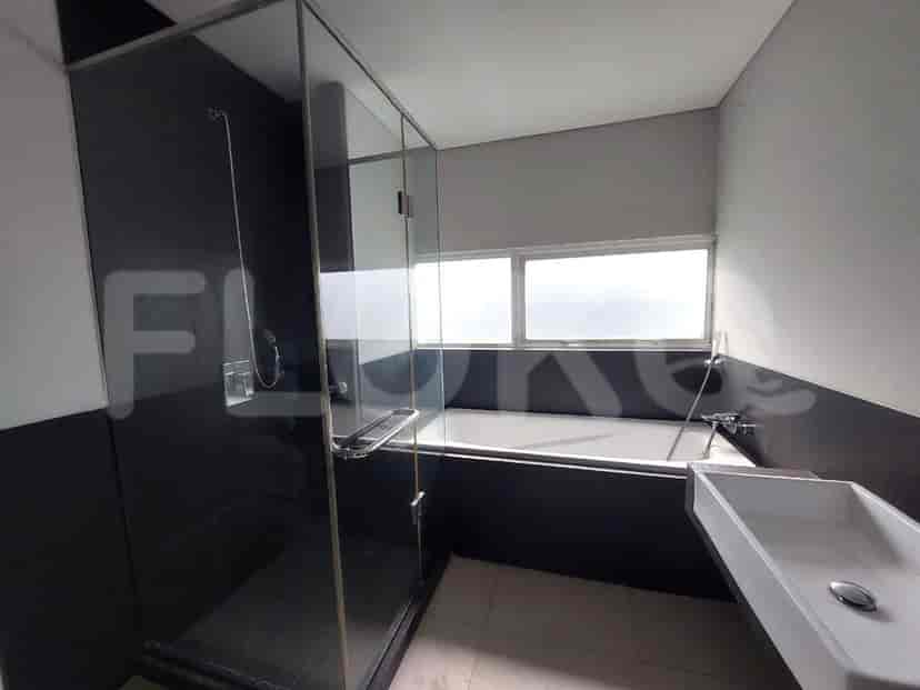 Contemporary bathroom with a bathtub and glass shower.