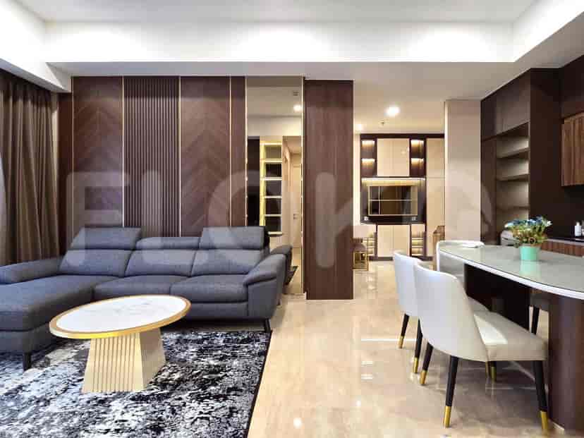 Modern living room with a gray sectional sofa, marble coffee table, and dining area.