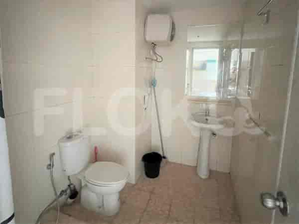 Bathroom with a toilet, sink, and shower.