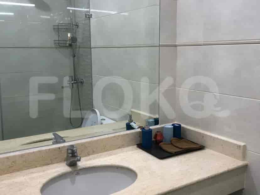 A clean bathroom with a sink and mirror.