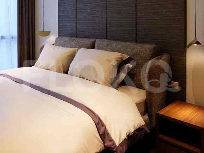 Bedroom with a bed, nightstands, and a simple, elegant aesthetic.