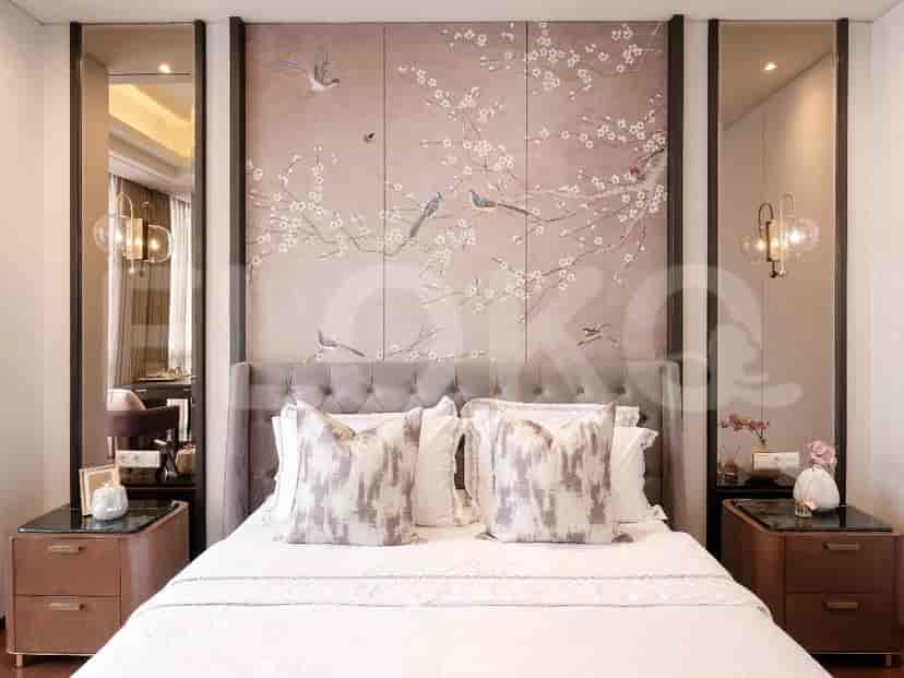 Master bedroom featuring a grey upholstered bed, bedside tables, and mirrors.