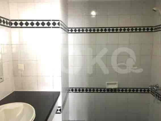 Modern bathroom with shower and toilet.
