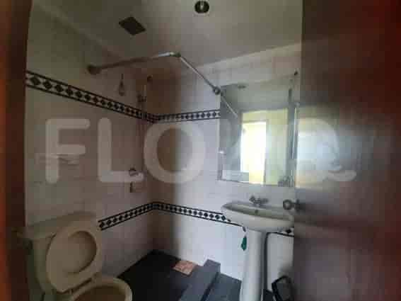 Another view of the bathroom with toilet and sink.