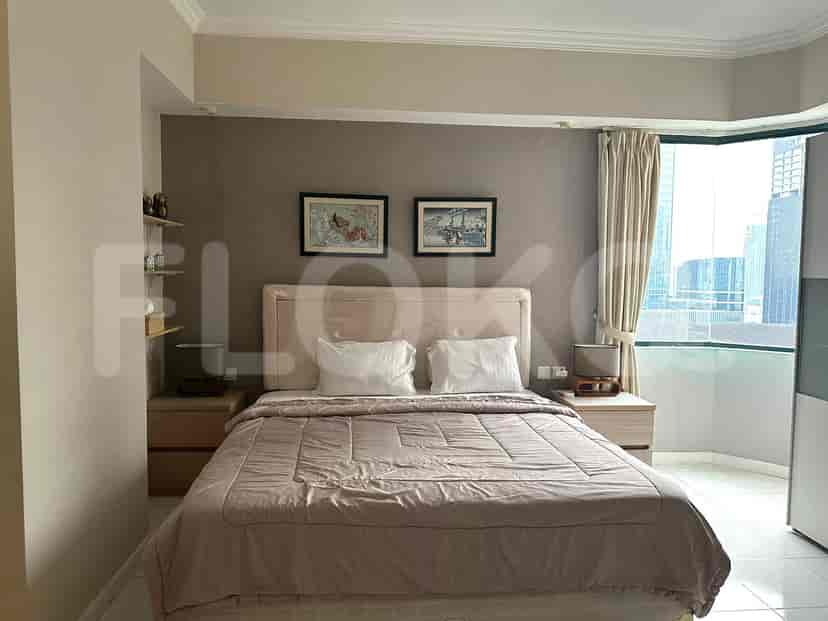 Bedroom with a large bed and city views.