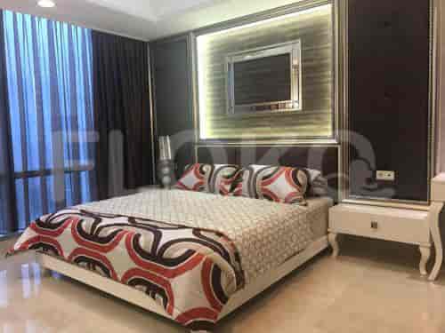 Stylish bedroom with a queen-sized bed, elegant decor, and city views.