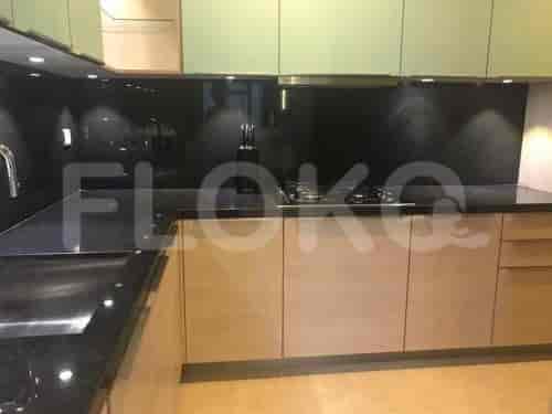 Contemporary kitchen showcasing a black granite countertop and wooden cabinetry.