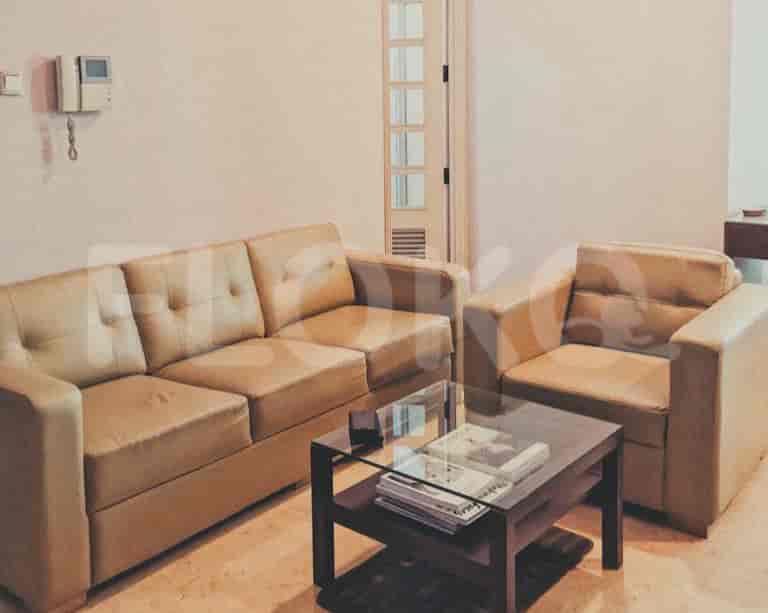 A living room setup with a sofa, coffee table, and modern decor.