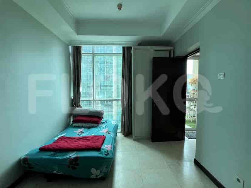 Bedroom with large window, single bed, and wardrobe.