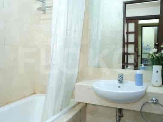 A bathroom with a bathtub and sink.