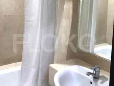 Bathroom with a bathtub and mirror.