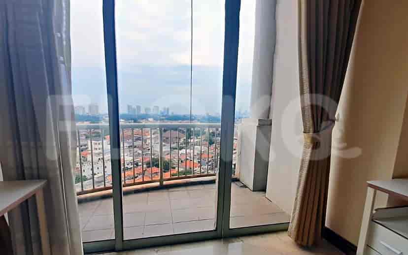 A balcony with a city view.