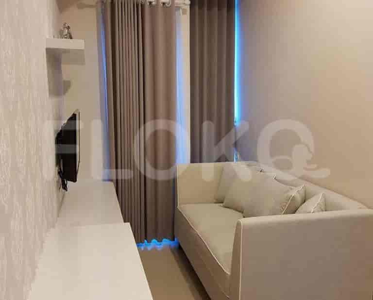 Living room with sofa and TV.