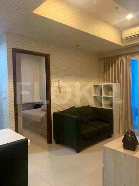 Another view of the bedroom, with a view of the window and curtain.