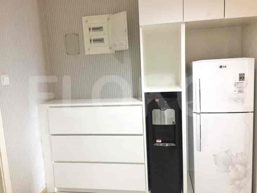 Kitchen space with additional built-in cabinets and appliances.
