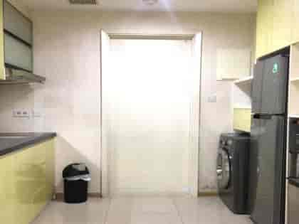 A kitchen featuring a door and appliances.