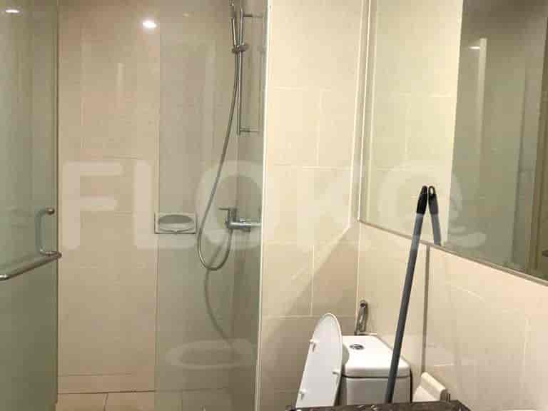 A clean bathroom with a glass shower enclosure.