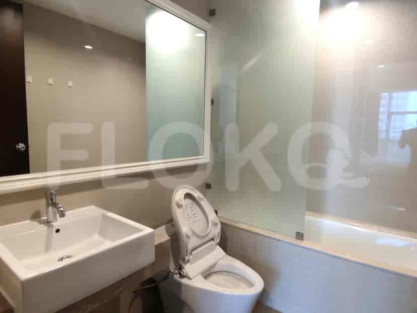 Another bathroom view showing the sink, mirror, and toilet.