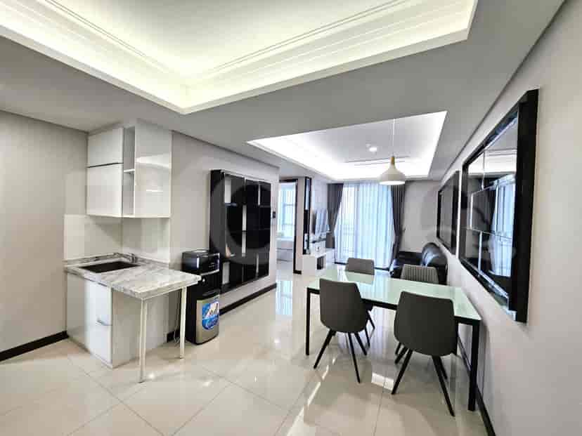 Kitchen with white cabinets and dining space.