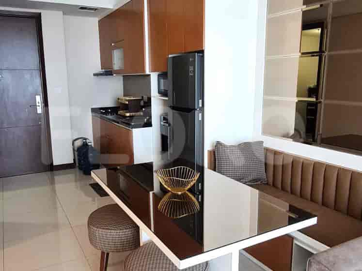 Dining area with a table and chairs adjacent to the kitchen.