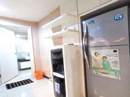 Kitchen with a refrigerator and water dispenser.