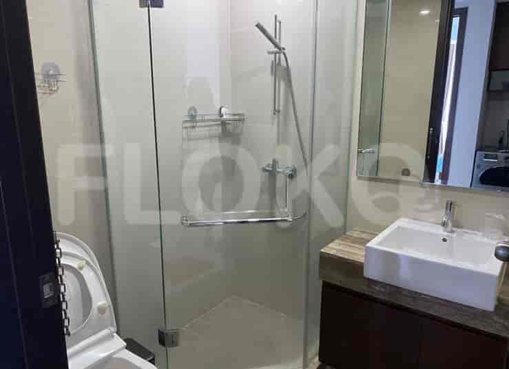 A modern bathroom with a glass shower.