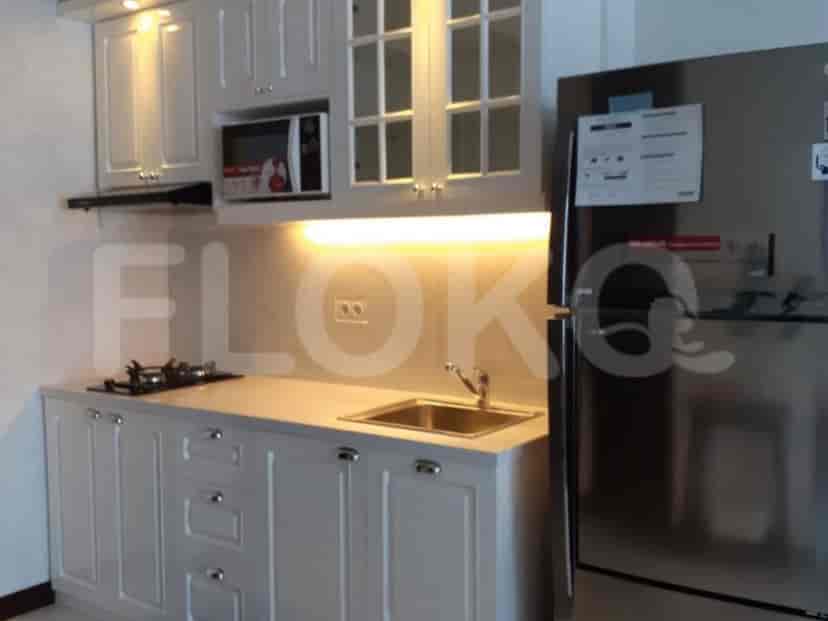 Modern kitchen with white cabinets, stainless steel appliances, and a gas stove.