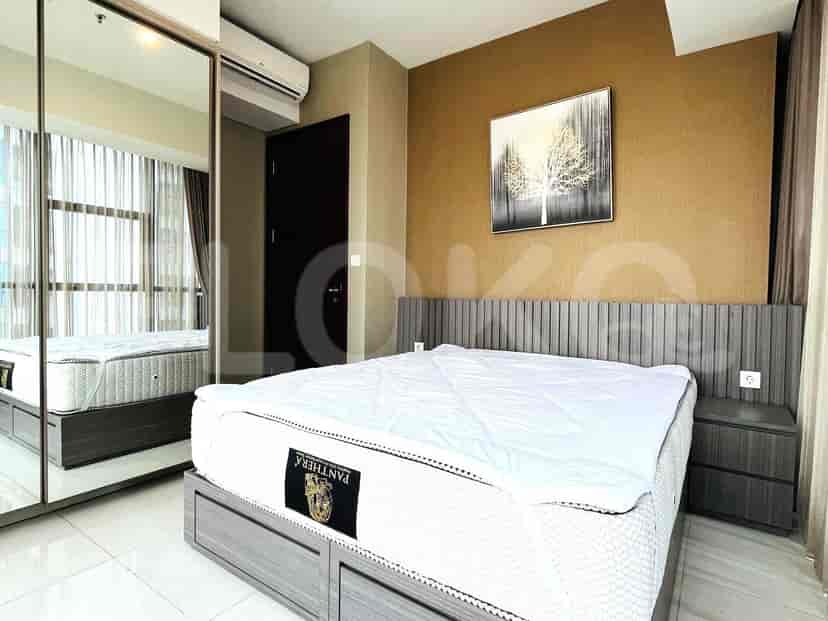 Bedroom with bed, mirror, and air conditioning.