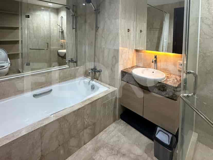 A luxurious bathroom with a bathtub and modern fixtures.
