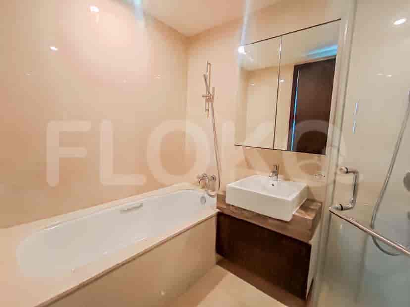 Bathroom with a bathtub, sink, and shower.