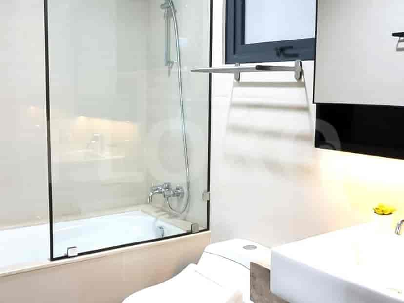 Contemporary bathroom featuring a bathtub, shower, and toilet.