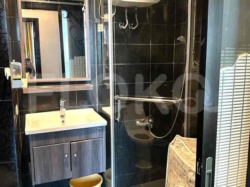 Contemporary bathroom with a dark aesthetic, shower, and sink.