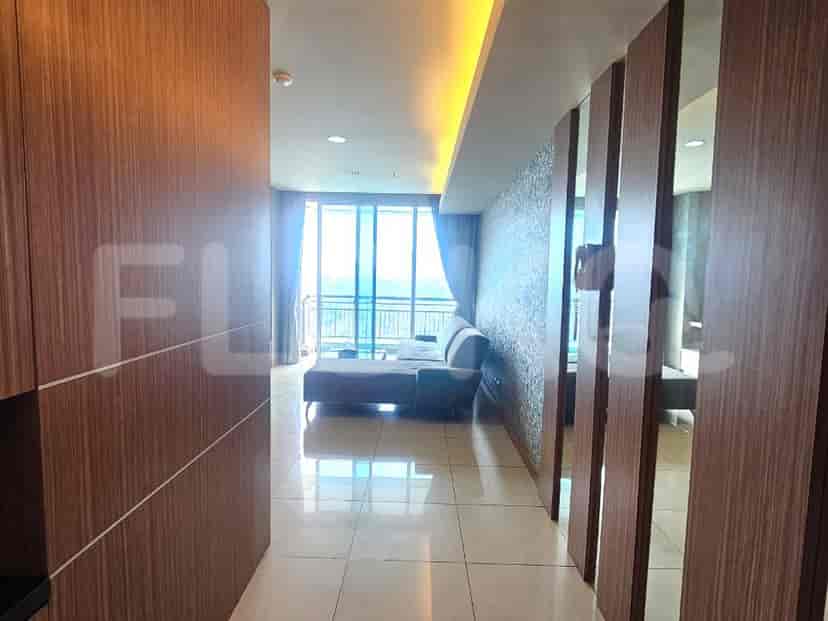 Hallway with access to living room and bedroom.