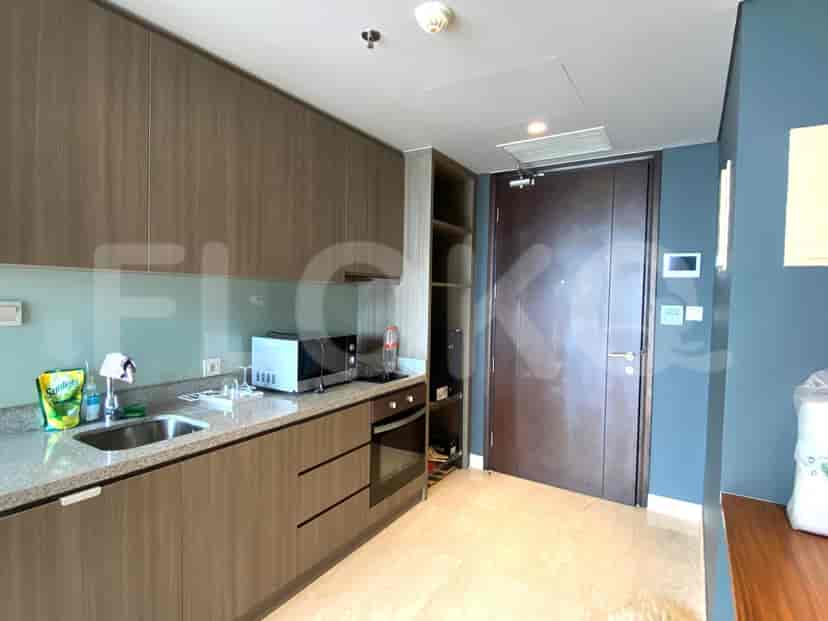 View of a kitchen with appliances.