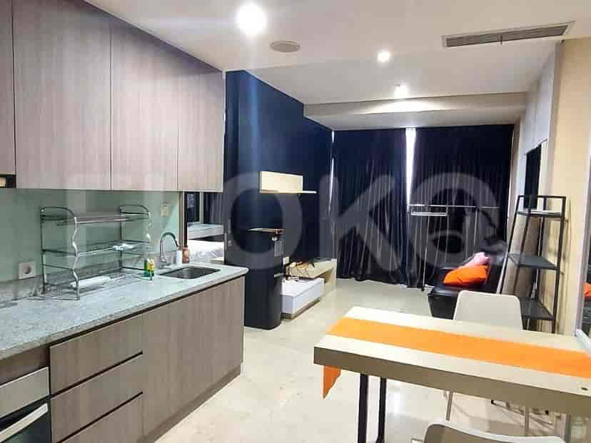 Combined living area and open kitchen showcasing modern design.