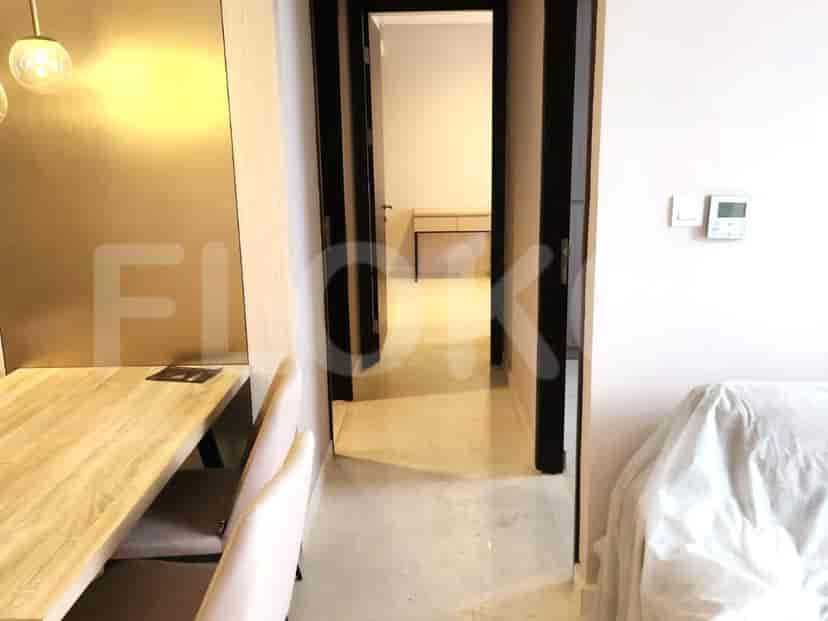 A hallway leading to rooms.