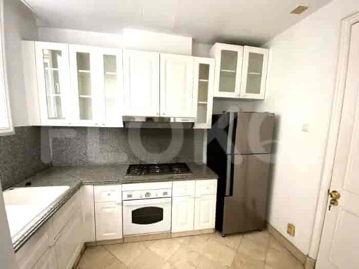 Kitchen with white cabinets, granite countertops, and stainless steel appliances.