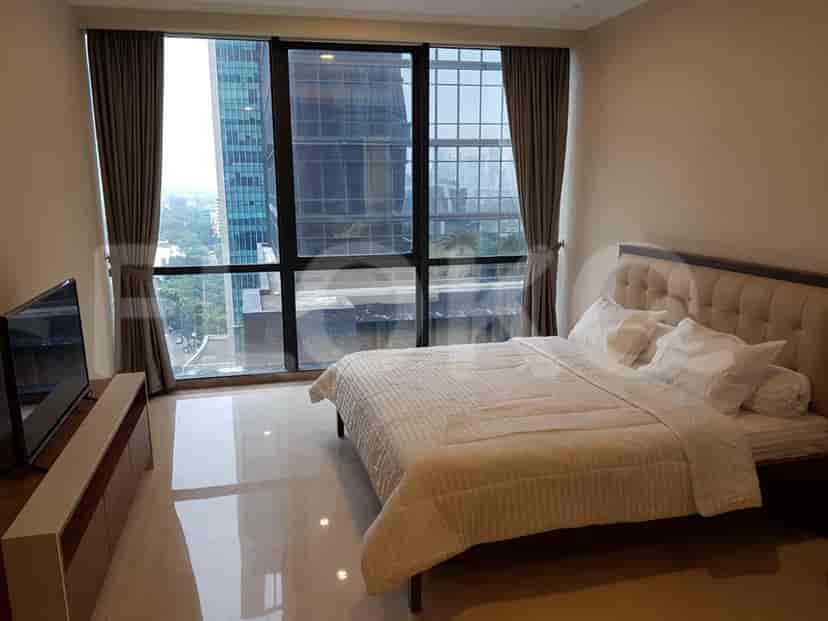Bedroom featuring a bed and floor-to-ceiling windows with city views.