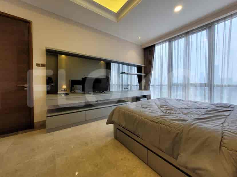 Master bedroom with built-in TV console, large bed, and panoramic city views.