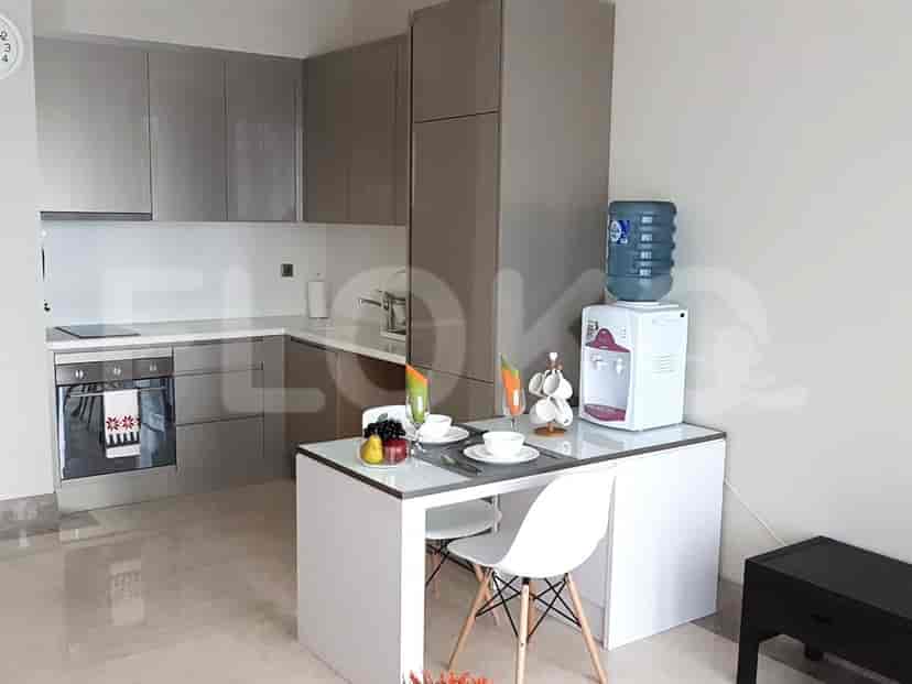 Modern kitchen and dining area with sleek design and appliances.