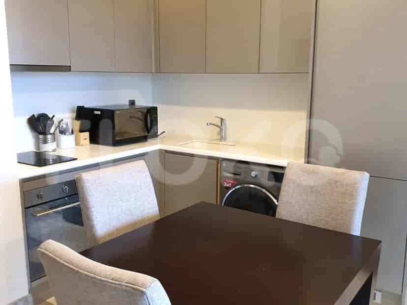 A modern kitchen with cabinets and appliances.
