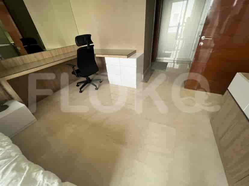Bedroom with a desk, suitable for working.
