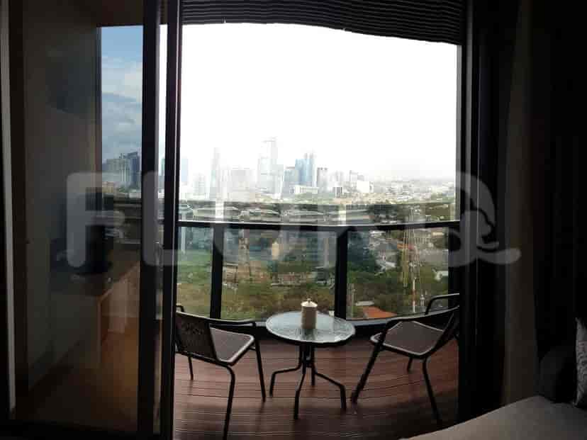 Bedroom with large windows offering a city view and a modern style.