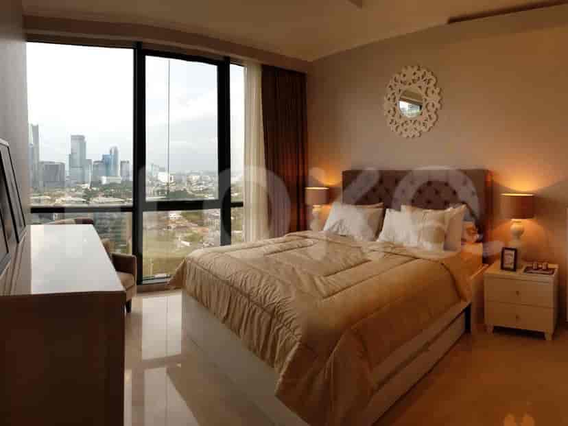 Bedroom featuring a dresser and armchair with city views.