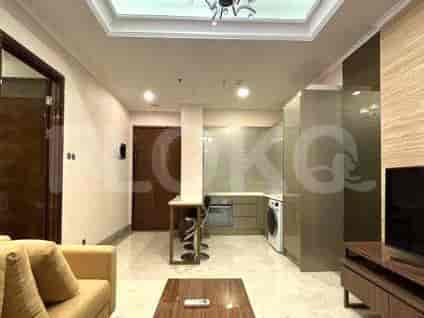 A well-equipped kitchen with modern appliances, and an entryway with a door and a small dining area.